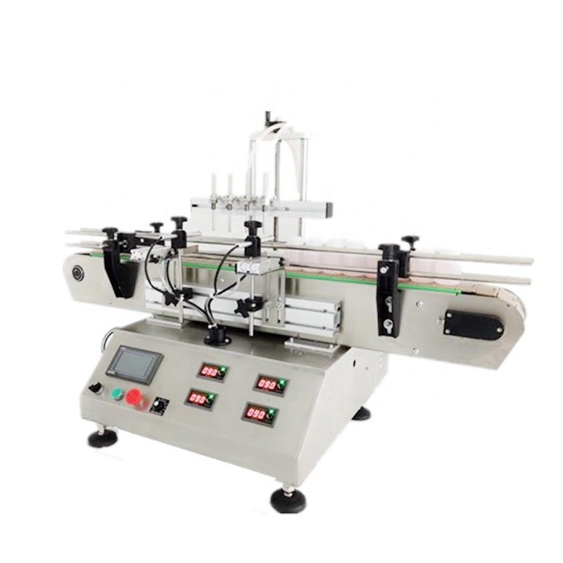 Macchina automatica per riempire le bottiglie di profumi e di prodotti cosmetici